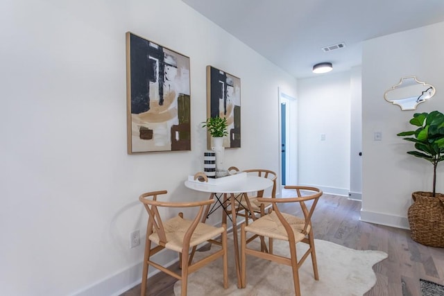 dining area with light hardwood / wood-style flooring