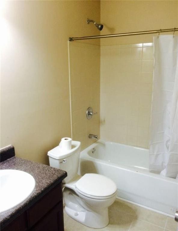full bathroom with vanity, tile patterned flooring, toilet, and shower / tub combo