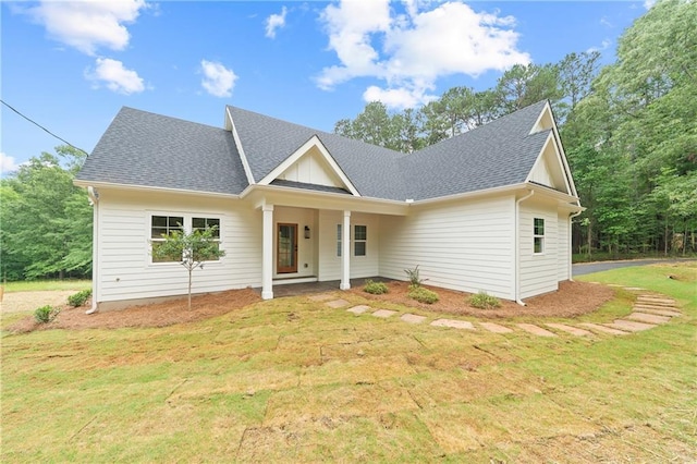 102-A S Cay Dr, Milledgeville, GA 31061 - view of front of property with a front yard, a shingled roof, and a porch