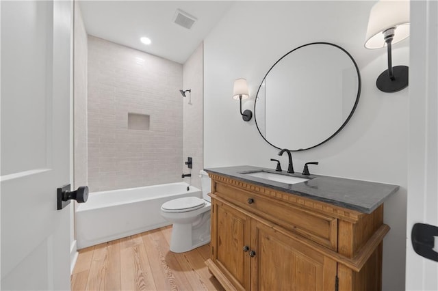 102-A S Cay Dr, Milledgeville, GA 31061 - bathroom with wood finished floors, vanity, toilet, bathtub / shower combination, and recessed lighting
