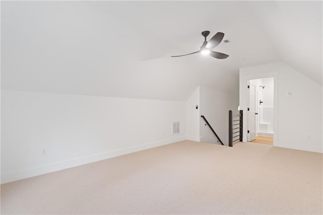 102-A S Cay Dr, Milledgeville, GA 31061 - additional living space featuring light carpet, vaulted ceiling, a ceiling fan, and baseboards