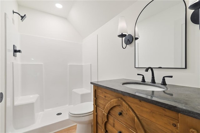 102-A S Cay Dr, Milledgeville, GA 31061 - bathroom with toilet, vanity, a shower, lofted ceiling, and wood finished floors