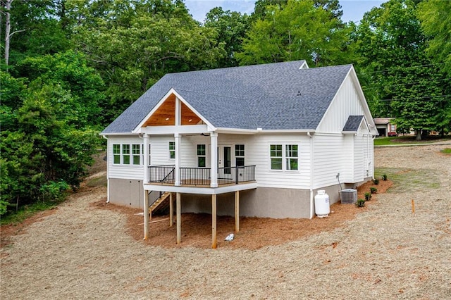 102-A S Cay Dr, Milledgeville, GA 31061 - back of property featuring a shingled roof, cooling unit, stairway, and a deck