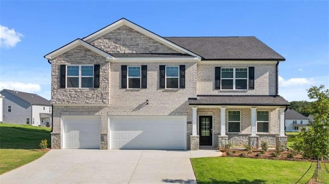 1139 Blue Juniper Cir, Loganville, GA 30052 - craftsman-style house with a front yard, driveway, brick siding, and a garage