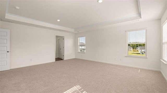 1139 Blue Juniper Cir, Loganville, GA 30052 - empty room featuring recessed lighting, carpet, a tray ceiling, and baseboards