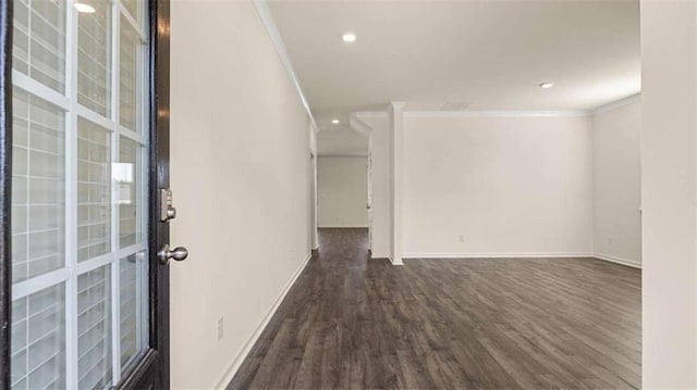 1139 Blue Juniper Cir, Loganville, GA 30052 - spare room with crown molding, baseboards, recessed lighting, and dark wood-type flooring