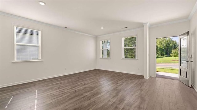 1139 Blue Juniper Cir, Loganville, GA 30052 - empty room with crown molding, baseboards, recessed lighting, and dark wood-style flooring