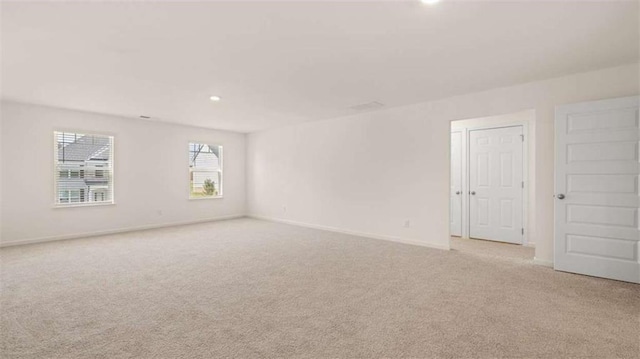 1139 Blue Juniper Cir, Loganville, GA 30052 - carpeted spare room with baseboards and recessed lighting