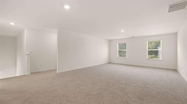 1139 Blue Juniper Cir, Loganville, GA 30052 - spare room featuring recessed lighting, visible vents, baseboards, and carpet floors