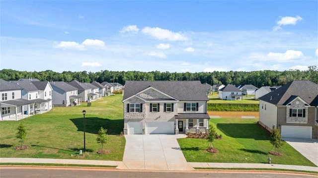 1139 Blue Juniper Cir, Loganville, GA 30052 - view of front of property featuring a front yard, driveway, a residential view, and a garage