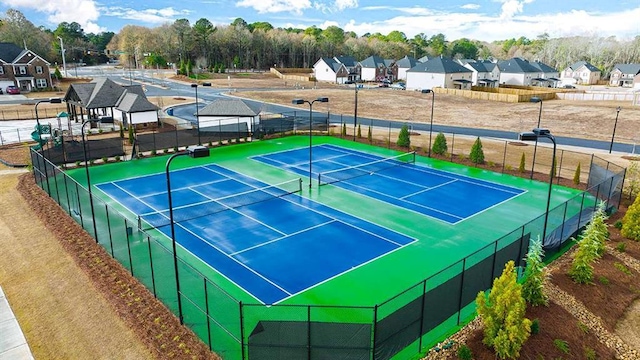 1139 Blue Juniper Cir, Loganville, GA 30052 - view of sport court with a residential view and fence