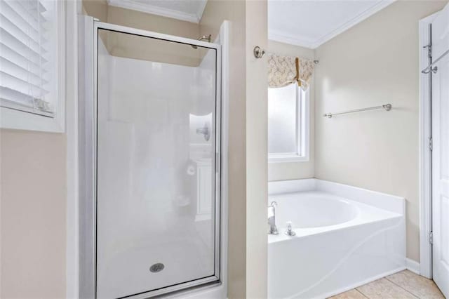 42 Hummingbird Ct, Jefferson, GA 30549 - bathroom with ornamental molding, a shower stall, a garden tub, and tile patterned flooring