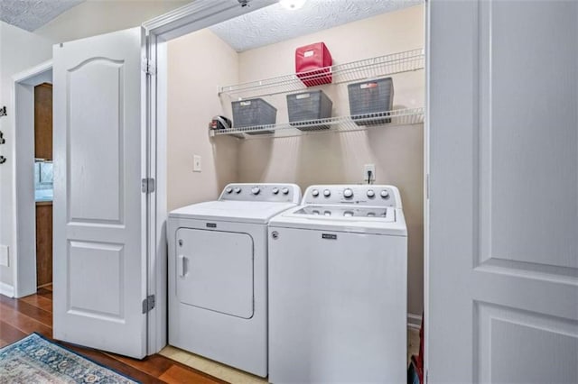 42 Hummingbird Ct, Jefferson, GA 30549 - laundry area featuring separate washer and dryer, wood finished floors, and a textured ceiling