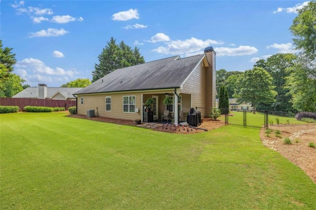 42 Hummingbird Ct, Jefferson, GA 30549 - rear view of house with a chimney and a gate