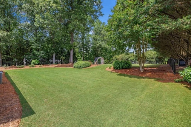 42 Hummingbird Ct, Jefferson, GA 30549 - view of grassy yard with view of wooded area