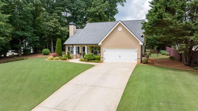 42 Hummingbird Ct, Jefferson, GA 30549 - view of front facade featuring concrete driveway, a chimney, and a garage