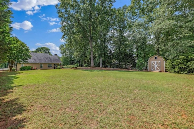 42 Hummingbird Ct, Jefferson, GA 30549 - view of green lawn featuring a storage shed and an outbuilding