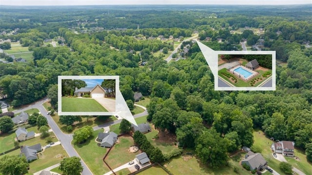 42 Hummingbird Ct, Jefferson, GA 30549 - aerial view of property and surrounding area with a forest, property parcel outlined, and a pool area