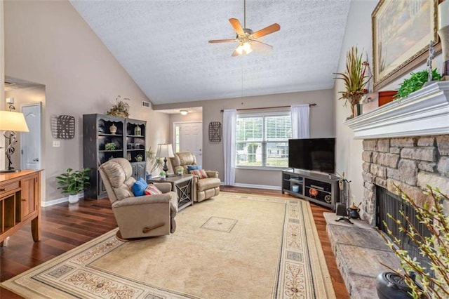 42 Hummingbird Ct, Jefferson, GA 30549 - living area featuring wood finished floors, a textured ceiling, ceiling fan, high vaulted ceiling, and a fireplace