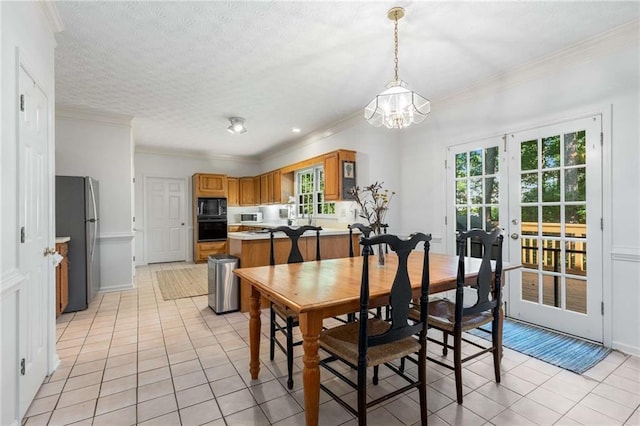 1950 Wenlok Trl NE, Marietta, GA 30066 - dining area with light tile patterned floors, a chandelier, plenty of natural light, ornamental molding, and french doors