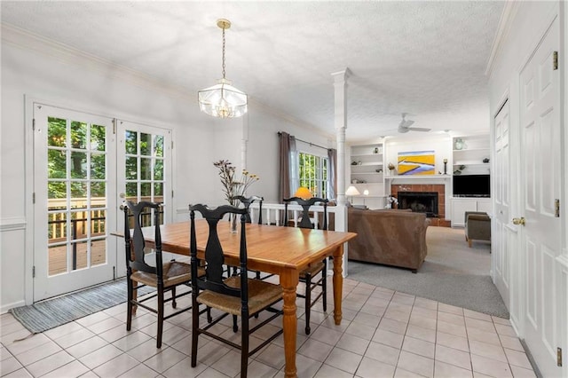 1950 Wenlok Trl NE, Marietta, GA 30066 - dining area with light tile patterned floors, ornamental molding, a textured ceiling, a fireplace, and built in features