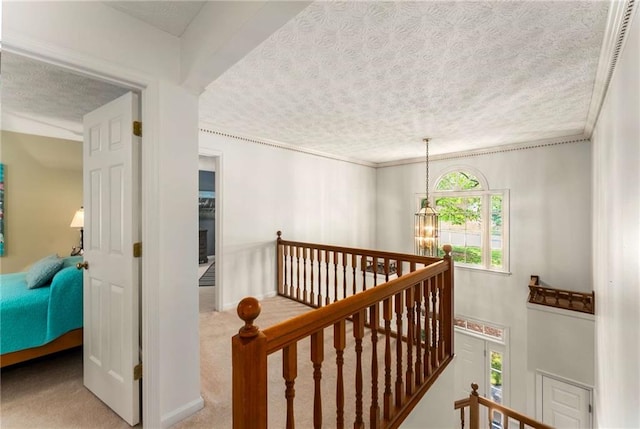 1950 Wenlok Trl NE, Marietta, GA 30066 - staircase featuring a textured ceiling, carpet floors, a chandelier, and crown molding