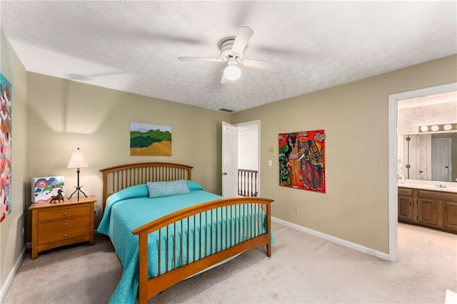 1950 Wenlok Trl NE, Marietta, GA 30066 - bedroom featuring light carpet, ensuite bath, a textured ceiling, and ceiling fan