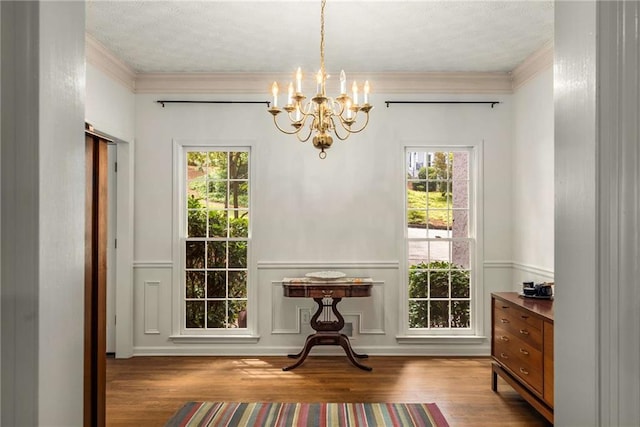 1950 Wenlok Trl NE, Marietta, GA 30066 - dining area with a chandelier, wood finished floors, ornamental molding, a decorative wall, and a wainscoted wall