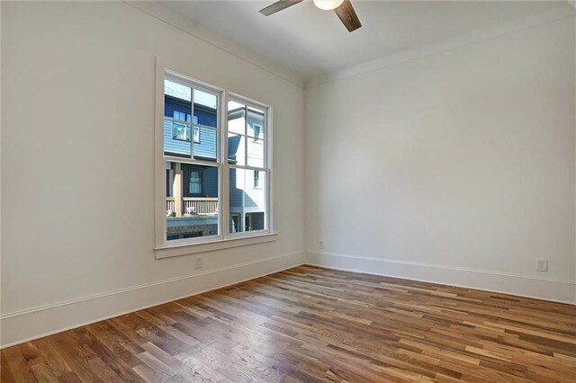 spare room with ornamental molding, hardwood / wood-style floors, and ceiling fan