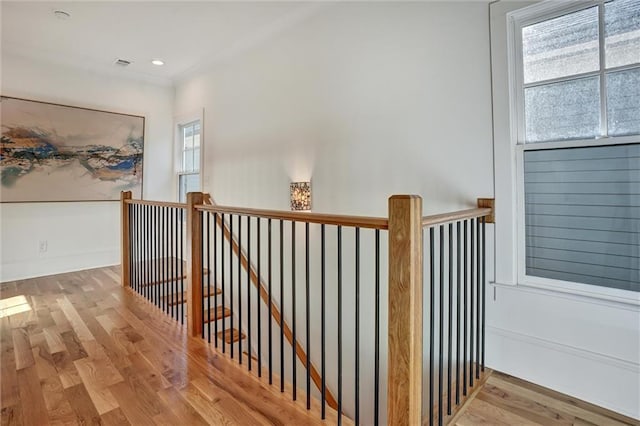 stairs featuring hardwood / wood-style flooring