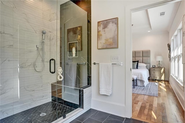 bathroom featuring hardwood / wood-style flooring and an enclosed shower