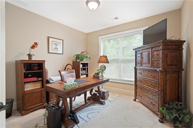 office with light colored carpet, visible vents, and baseboards