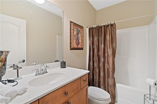 bathroom with shower / tub combo with curtain, toilet, and vanity