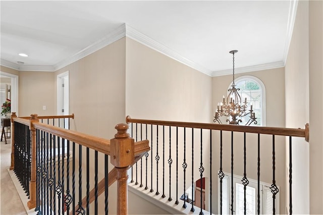 hall with an upstairs landing, ornamental molding, recessed lighting, and a notable chandelier