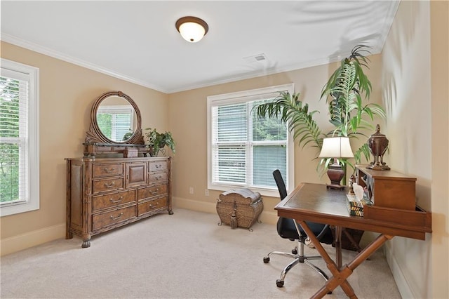 carpeted home office featuring baseboards, visible vents, and crown molding