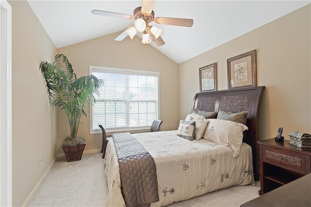 bedroom featuring lofted ceiling, a ceiling fan, light colored carpet, and baseboards