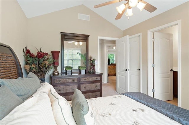 bedroom featuring visible vents, a ceiling fan, light colored carpet, and vaulted ceiling