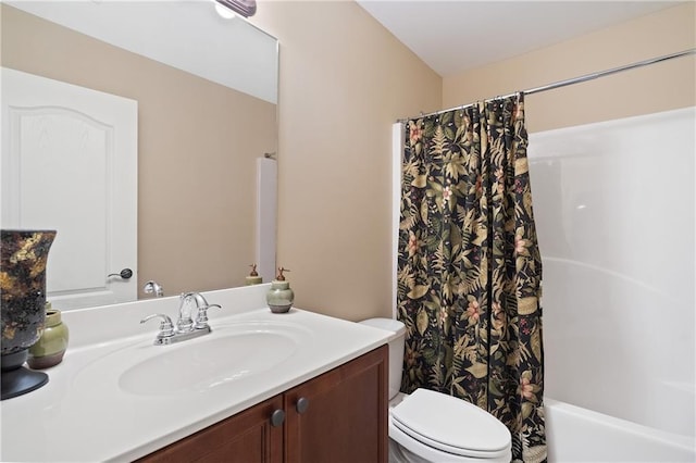 bathroom featuring toilet, shower / bath combo, and vanity