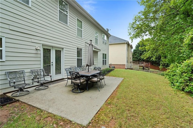 view of patio / terrace with french doors and fence