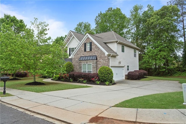 view of front facade featuring a front lawn, driveway, stone siding, and a garage