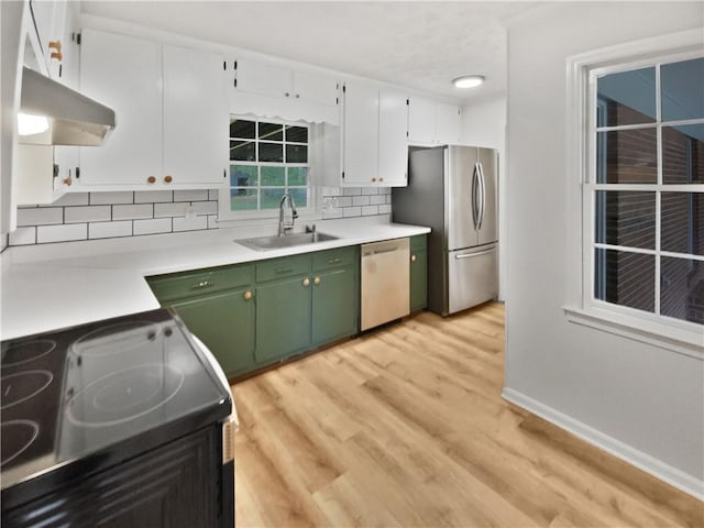 kitchen featuring sink, white cabinetry, light hardwood / wood-style flooring, green cabinets, and appliances with stainless steel finishes