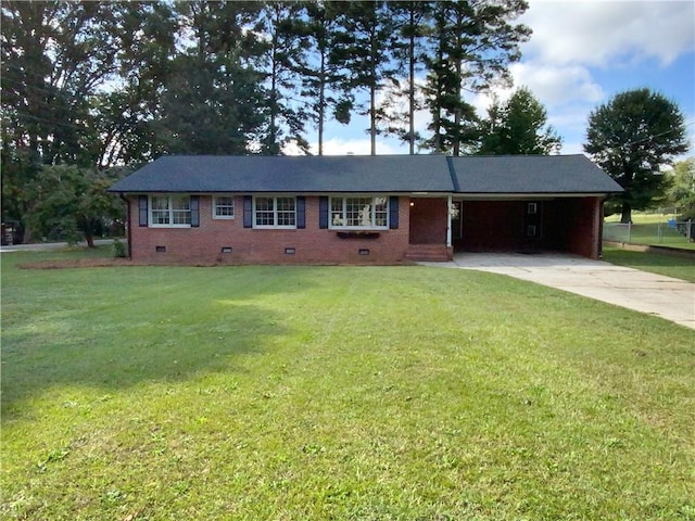 ranch-style house featuring a front yard and a carport