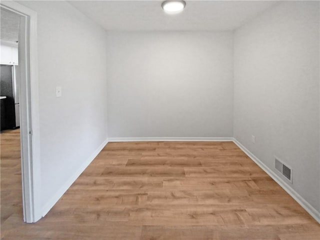 empty room with light wood-type flooring