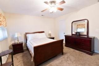 566 Sugar Valley Ln, Conyers, GA 30094 - bedroom featuring light carpet and a ceiling fan