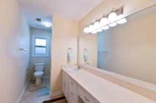 566 Sugar Valley Ln, Conyers, GA 30094 - bathroom featuring toilet, baseboards, and vanity