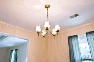 566 Sugar Valley Ln, Conyers, GA 30094 - interior details featuring ornamental molding, visible vents, and an inviting chandelier