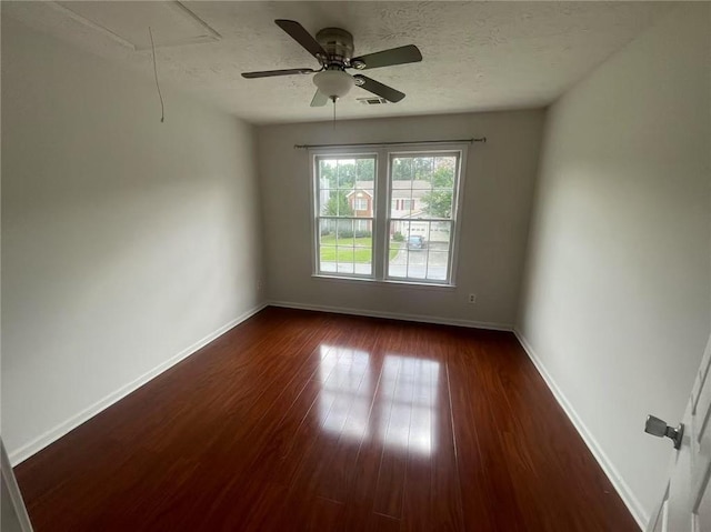 2994 Abbotts Oak Way, Duluth, GA 30097 - spare room with attic access, dark wood finished floors, a textured ceiling, and a ceiling fan