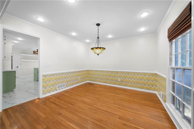 spare room with ornamental molding, visible vents, recessed lighting, and marble finish floor