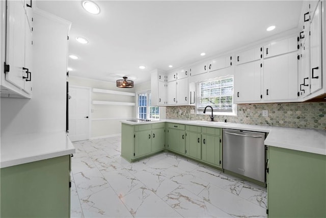 kitchen featuring stainless steel dishwasher, sink, decorative backsplash, white cabinetry, and green cabinetry