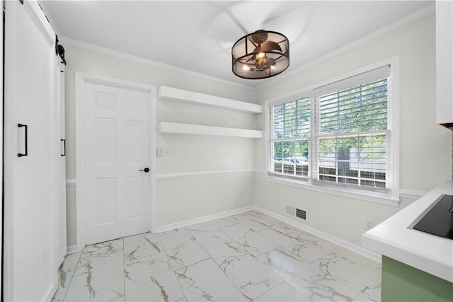 unfurnished dining area with ornamental molding